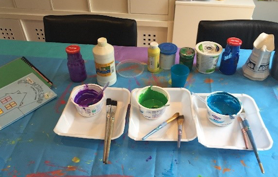 Prepping paint for painted paper art lesson
